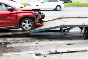 Car loaded onto tow truck